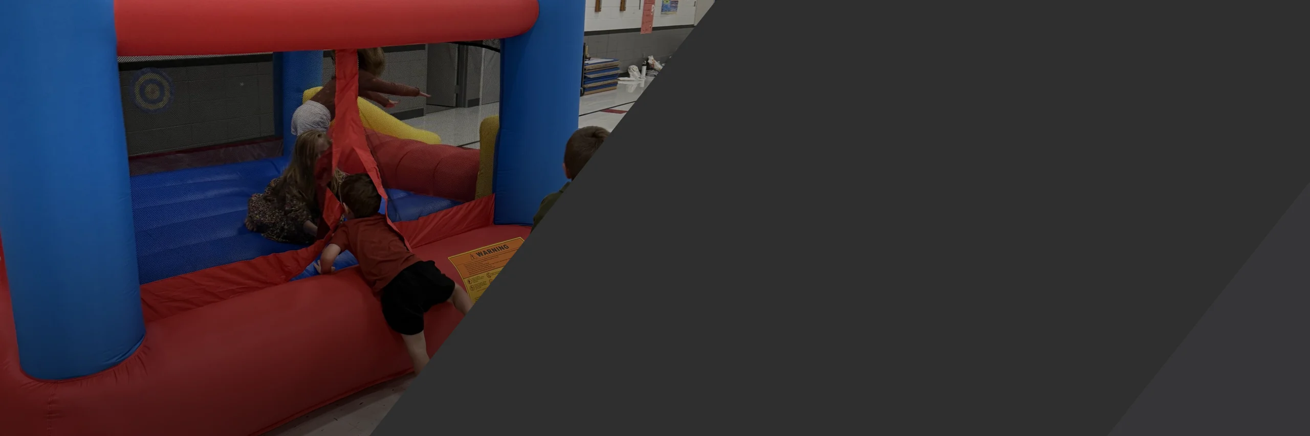 A bounce house in the gym at a Clarity Church family event in Brooklyn Park