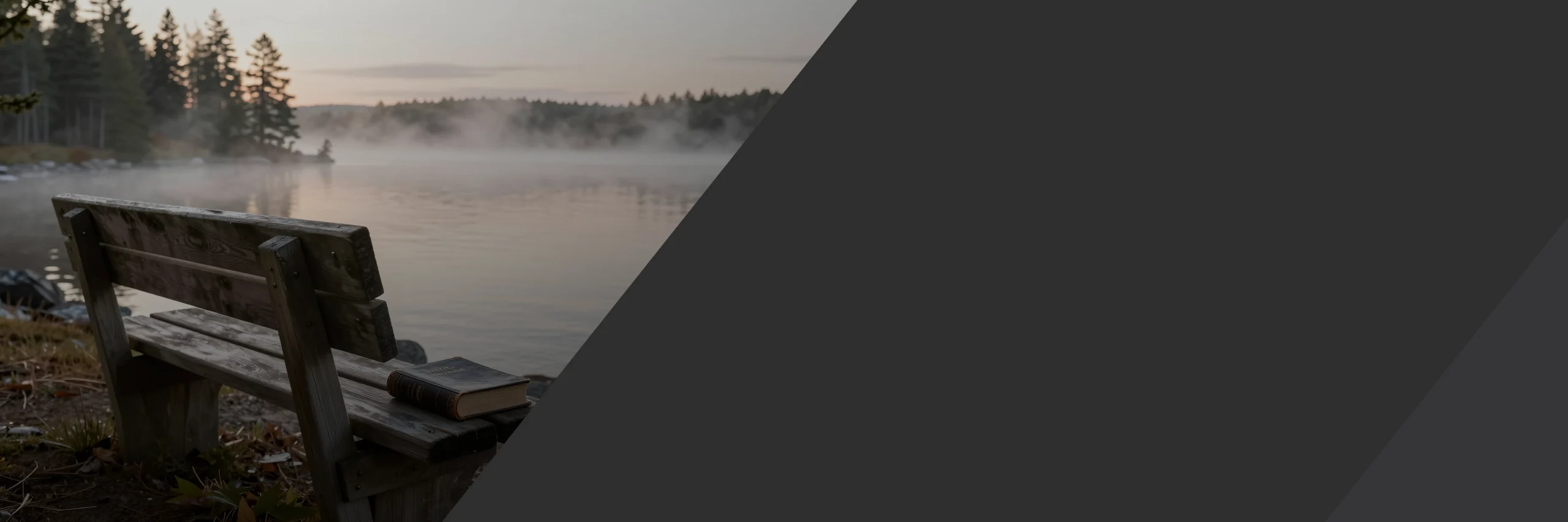A wooden bench with a Bible beside a misty Minnesota lake at sunrise, a quiet place to pray