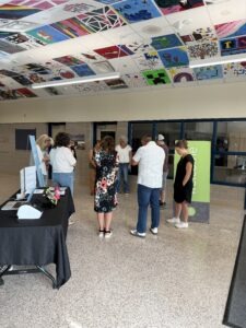 People gathering in the school lobby on a Sunday morning at Clarity Church in Brooklyn Park